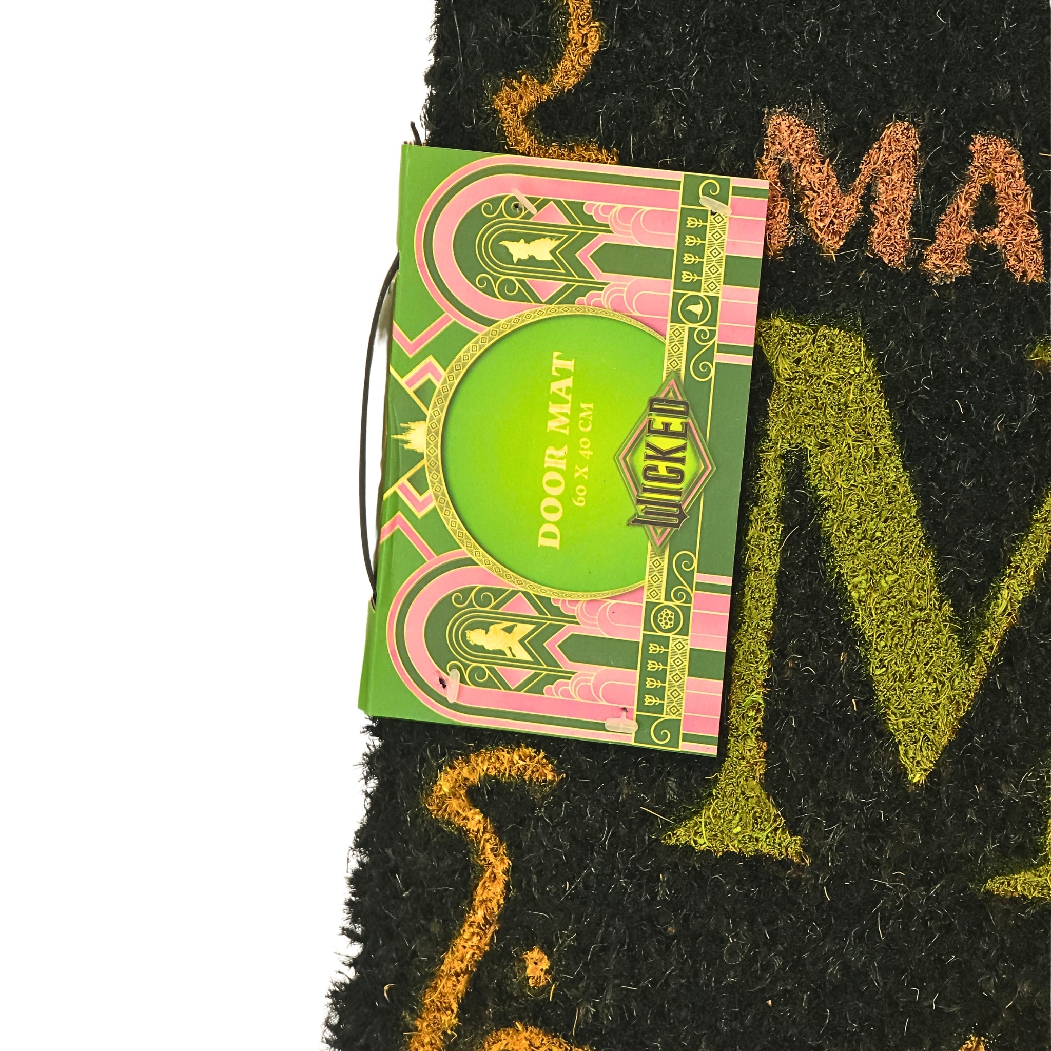 Detalle etiqueta oficial Wicked y textura de fibra de coco natural del felpudo Make Your Own Magic
